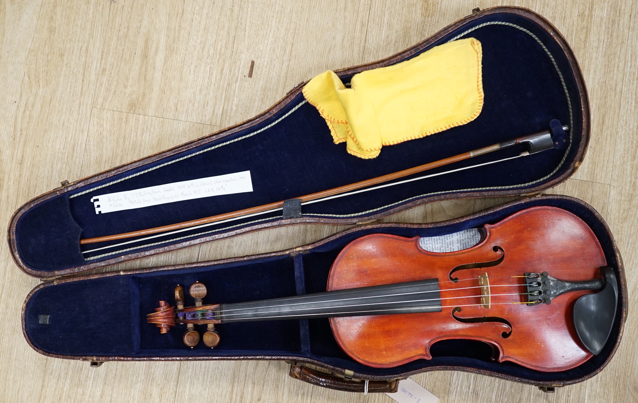 An English cased violin by Thomas J. Bellingham, Leeds, 1909, body length, 35.5cm, with a chased silver mounted bow CITES Submission reference WNR7TU27